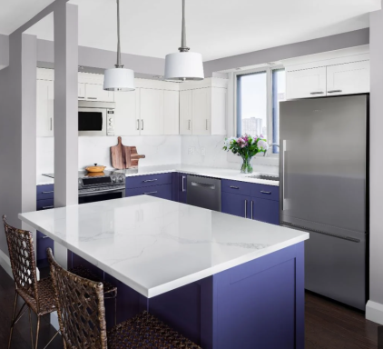 Modern kitchen featuring purple cabinets, marble countertops, and stainless steel appliances.